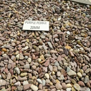 A collection of multicolored pebbles with a sign that reads "PURPLE PEBBLE 20MM" placed on top.